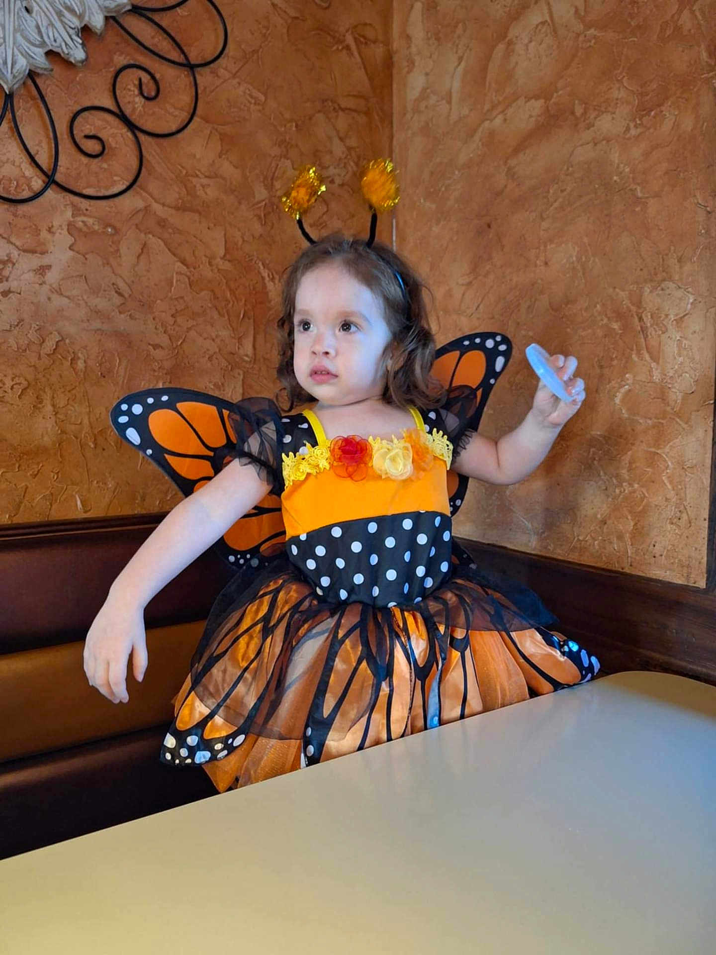 Amara is registered to the contest to win money with this photo: child, clothing, costume, cream, dessert, dress, face, female, flower, flowerarrangement, food, girl, head, icing, person, photography, plant, portrait, pottedplant, sitting