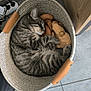 basket, cat, cozy, cute, domestic_animal, feline, footwear, gray_cat, home, indoor, pet, plush_toy, relaxation, resting, sandal, sleeping, striped_fur, tabby_cat, tile_floor, wooden_cabinet
