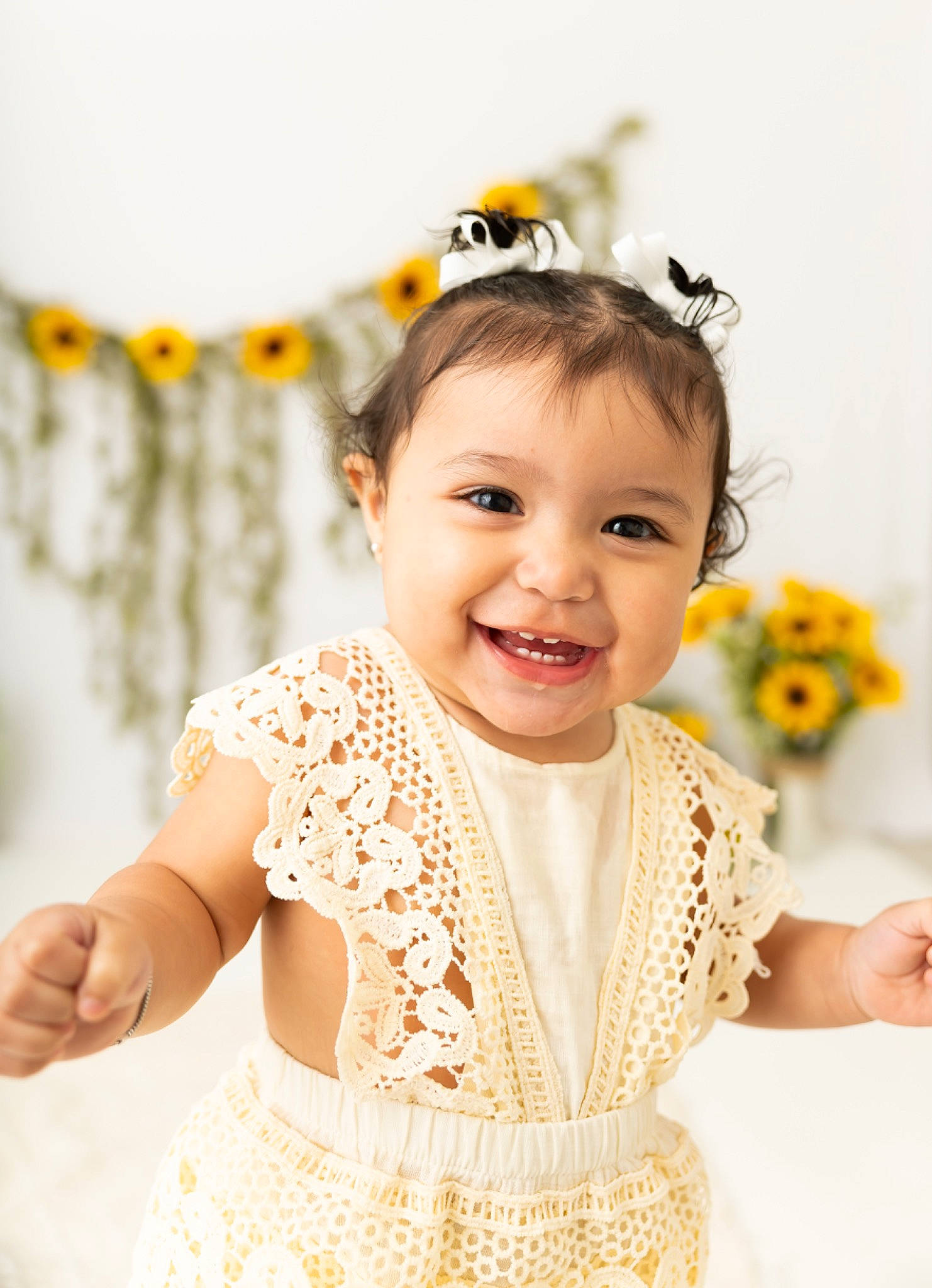 Emory is registered to the contest to win money with this photo: arm, baby, baby_toddler_clothing, day_dress, dress, fashion_design, flash_photography, flower, happy, headpiece, iris, jewellery, joy, neck, necklace, pattern, person, skin, sleeve, smile