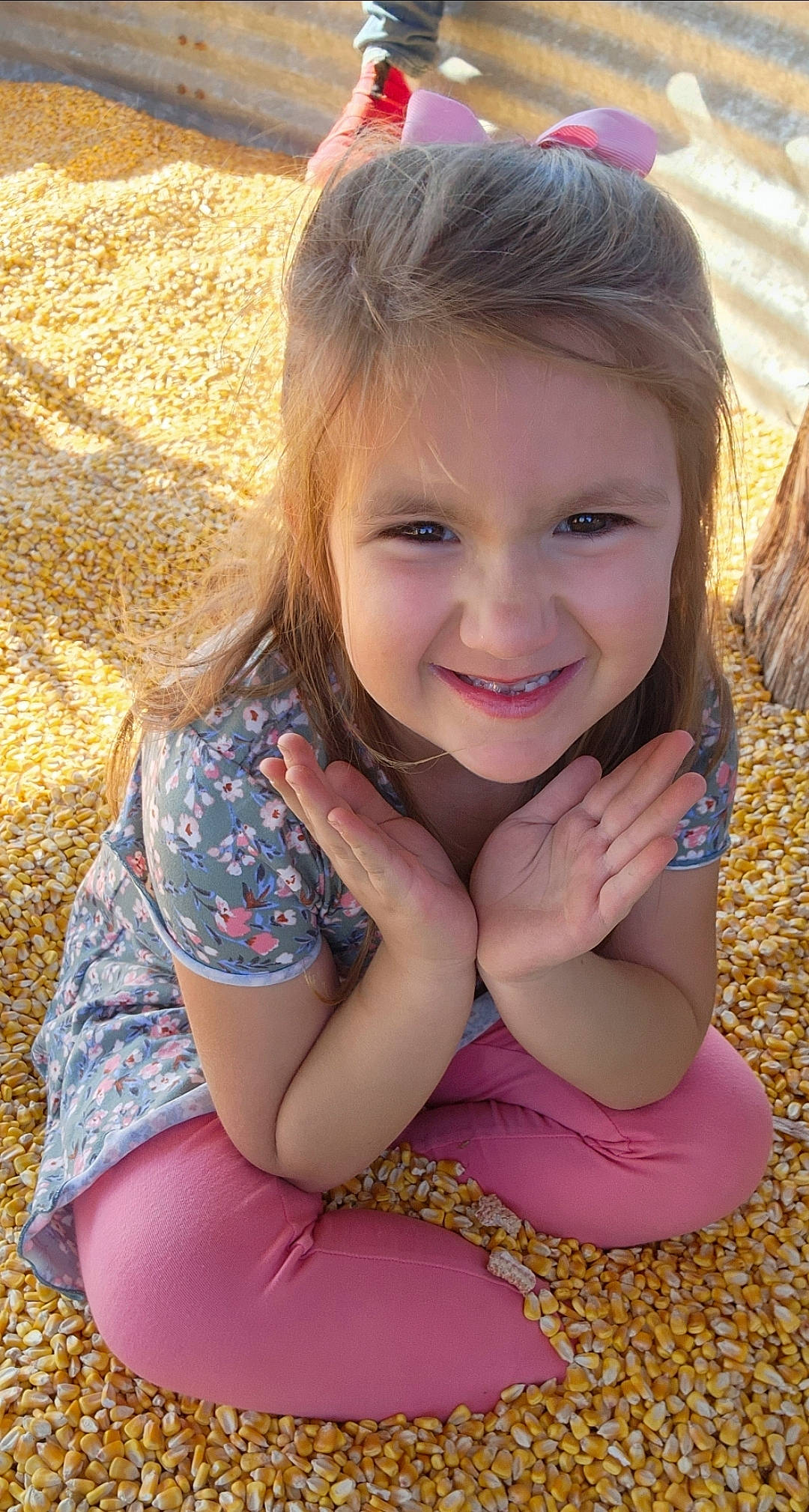 Elora joined the competition — help win amazing prizes! eye, fawn, fun, grass, happy, human_body, human_leg, iris, joy, leisure, lip, long_hair, mouth, people_in_nature, person, pink, plant, skin, smile, sunlight