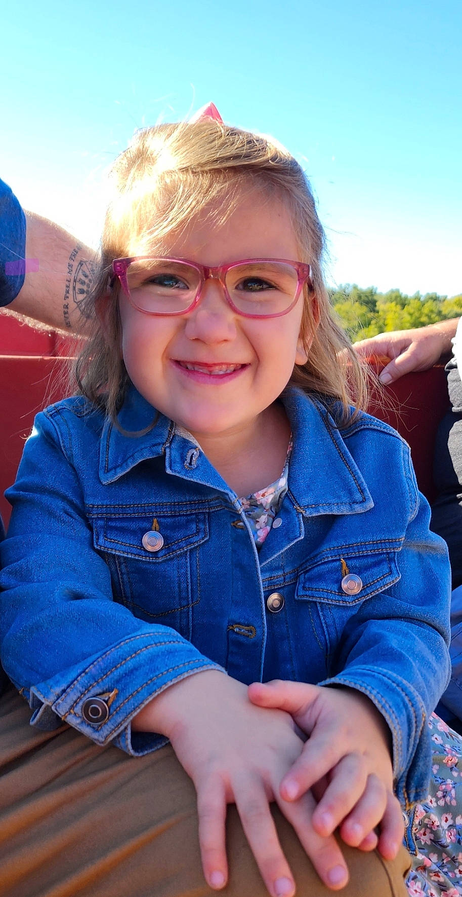 Elora joined the competition — help win amazing prizes! blond, blue, child, electric_blue, eyewear, fun, grass, hair, happy, head, joy, leisure, lip, person, sitting, skin, sky, sleeve, smile, travel