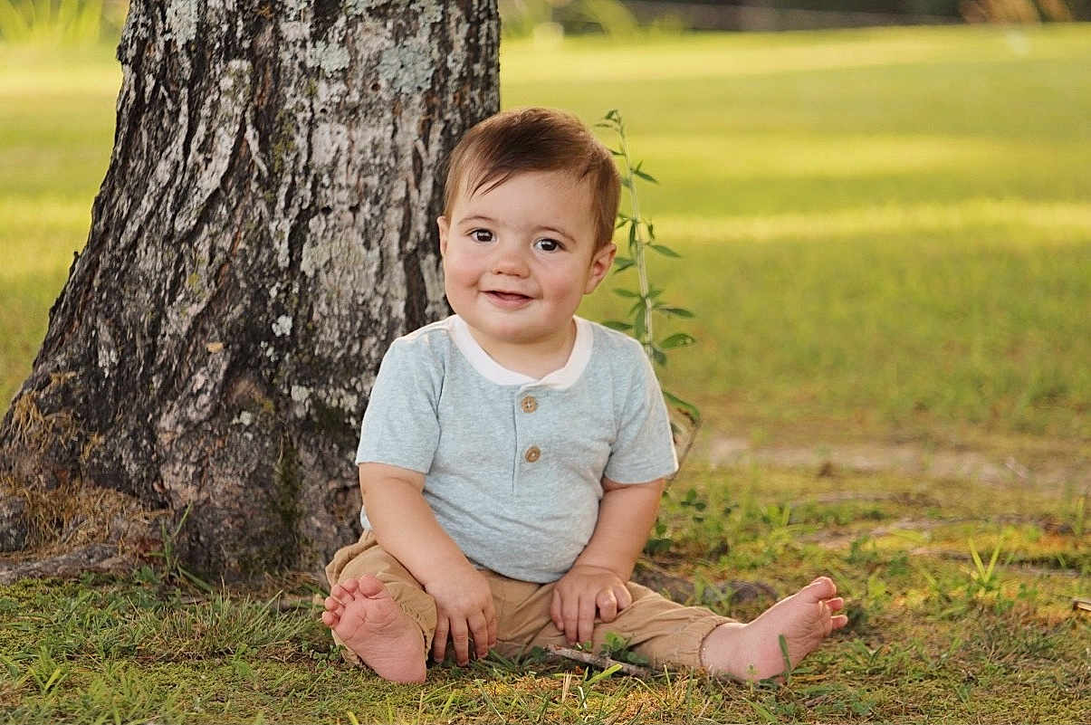 Carson joined the competition — help win amazing prizes! child, toddler, baby, grass, tree, outdoor, smiling, barefoot, nature, greenery, sitting, portrait, casual_clothing, short_sleeve, pants, happy, young, daylight, cute, one_person