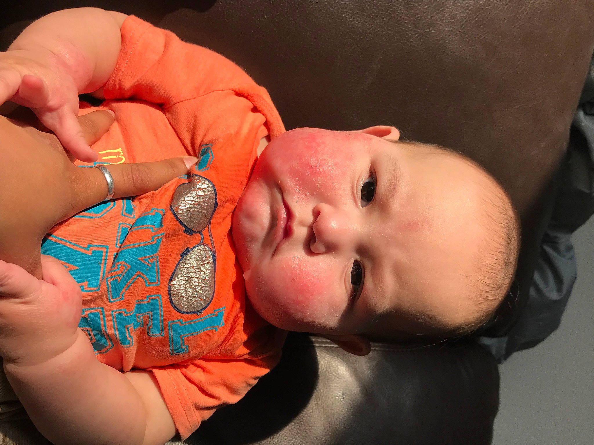 Brooklyn is registered to the contest to win money with this photo: baby, baby_toddler_clothing, cheek, chin, ear, eyebrow, eyelash, finger, gesture, hand, headgear, human, lip, mammal, mouth, neck, nose, person, product, skin