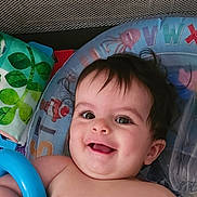 Ryland is registered to the contest to win money with this photo: baby, smiling, face, infant, playmat, toy, colorful, frog, cloth, inflatable, neck_float, alphabet, child, happy, cute, indoors, person, play, blue_ring, closeup