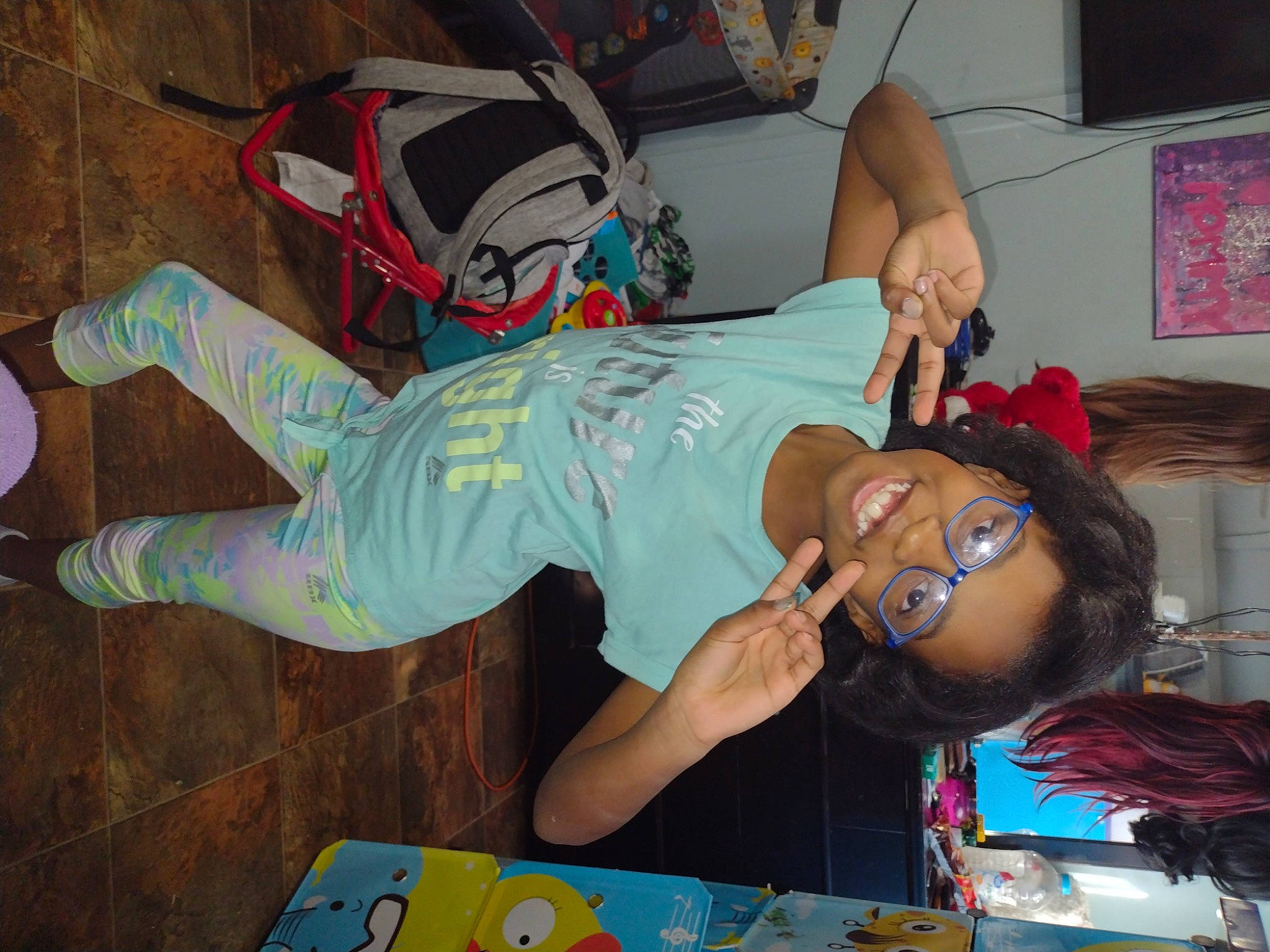 Ari Anna is registered to the contest to win money with this photo: animation, arm, chest, child, costume, eyewear, fun, hat, human_leg, joy, knee, leisure, mouth, party, person, room, snapshot, sunglasses, t_shirt, thigh