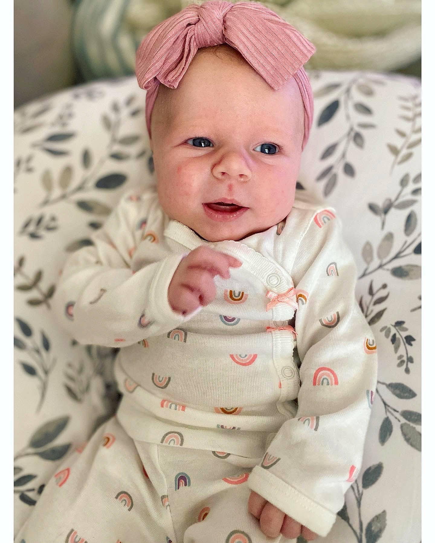 Phoebe is registered to the contest to win money with this photo: baby, baby_toddler_clothing, cap, cheek, chin, collar, comfort, face, head, lip, outerwear, person, photograph, pink, product, skin, sleeve, smile, textile, toddler