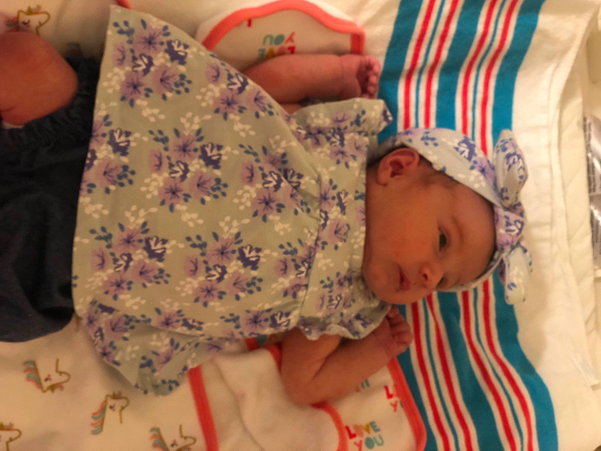 Juliet is registered to the contest to win money with this photo: baby, baby_toddler_clothing, cheek, child, comfort, facial_expression, finger, head, human_body, joint, mammal, mouth, neck, organ, pattern, person, skin, sleeve, textile, thigh