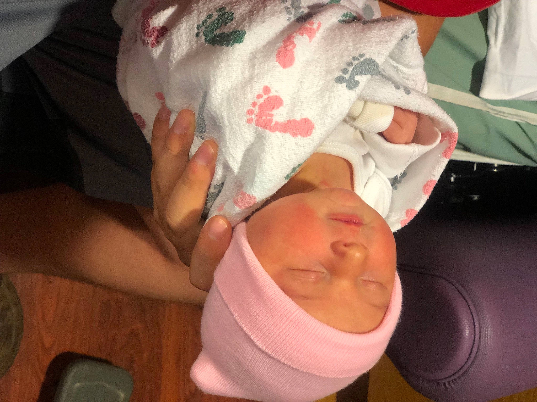 Juliet is registered to the contest to win money with this photo: baby, cap, child, comfort, elbow, facial_expression, fun, gesture, happy, hat, headgear, headwear, human_leg, linens, mouth, nail, person, sleeve, t_shirt, textile