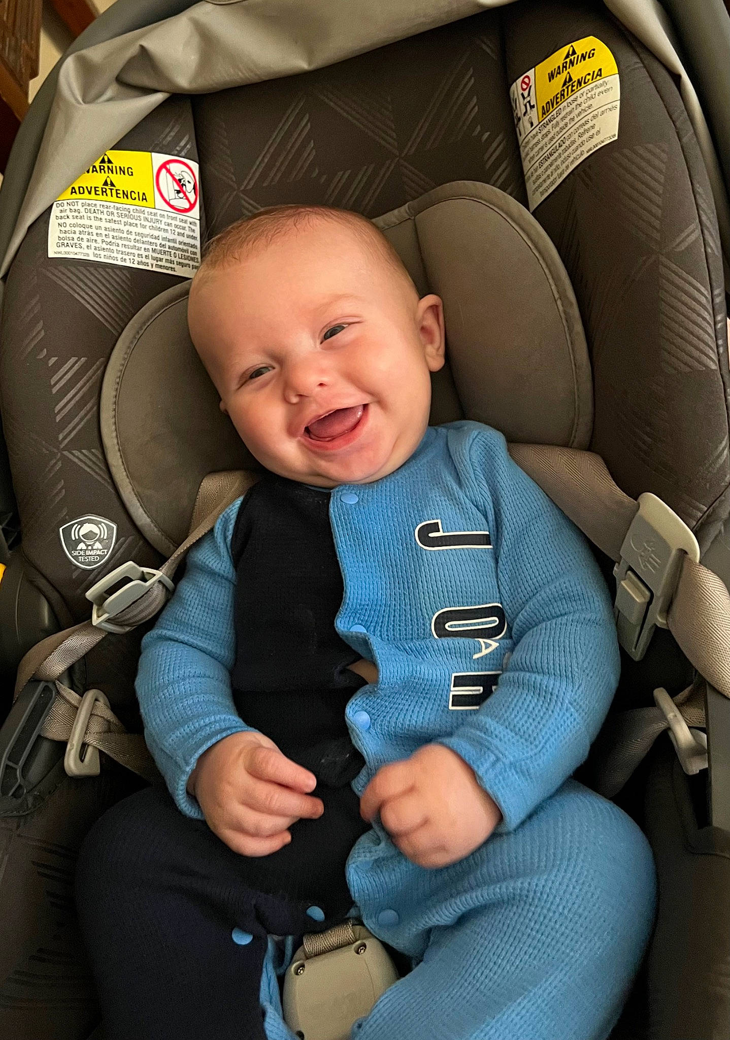 Azaiah is registered to the contest to win money with this photo: armrest, auto_part, baby, baby_carriage, baby_in_car_seat, baby_products, baby_toddler_clothing, car_seat, car_seat_cover, child, comfort, electric_blue, head_restraint, person, seat_belt, sitting, smile, thumb, toddler