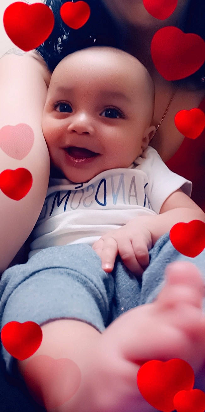 Daxton joined the competition — help win amazing prizes! arm, baby_playing_with_toys, comfort, face, facial_expression, finger, gesture, hand, happy, leg, muscle, person, pink, red, skin, smile, standing, thigh, thumb, toddler