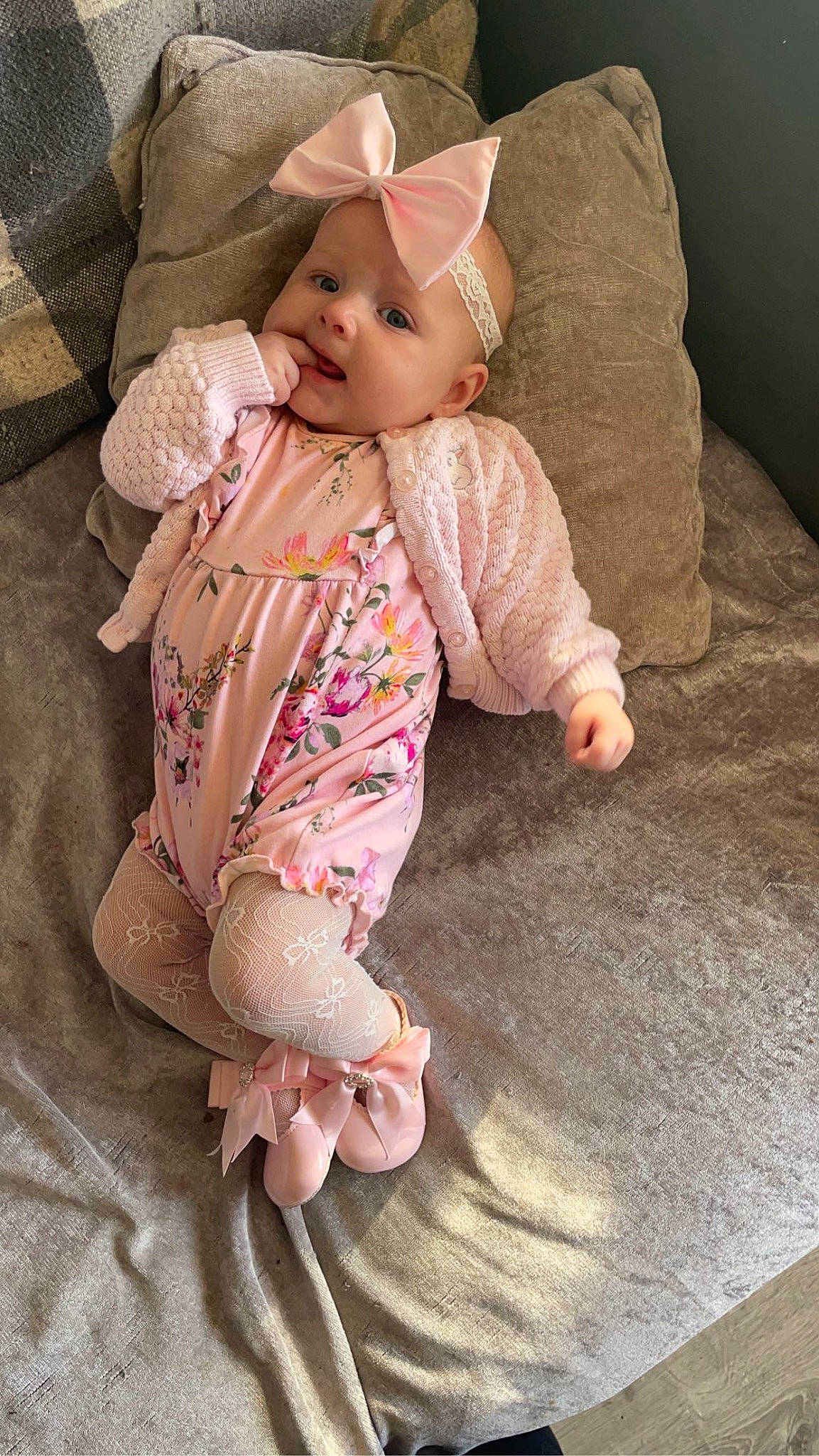Kenzie joined the competition — help win amazing prizes! baby, baby_toddler_clothing, cheek, child, comfort, dress, fashion_accessory, foot, human_body, leg, linens, outerwear, pattern, person, pink, sitting, skin, sleeve, smile, textile