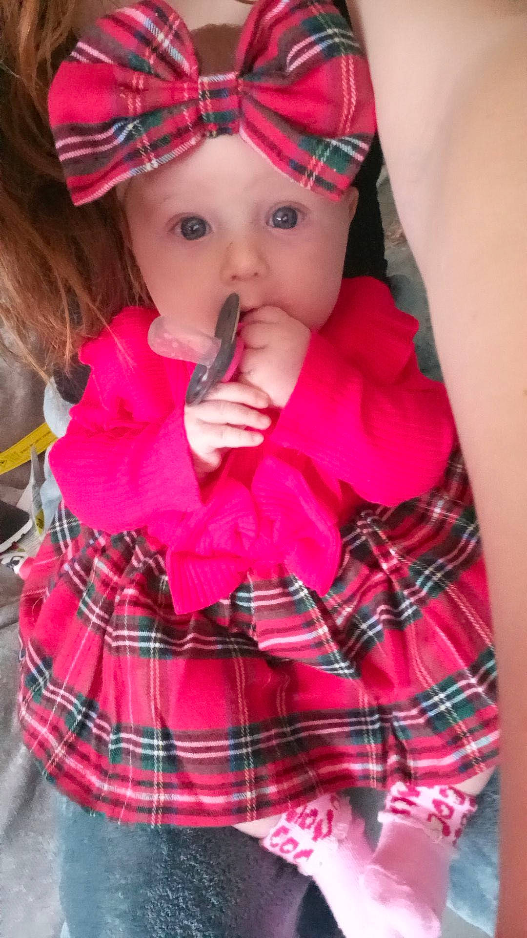 Kenzie joined the competition — help win amazing prizes! baby, baby_toddler_clothing, cap, cheek, clothing, collar, dress, face, headwear, lip, magenta, outerwear, pattern, person, pink, plaid, red, skin, sleeve, tartan