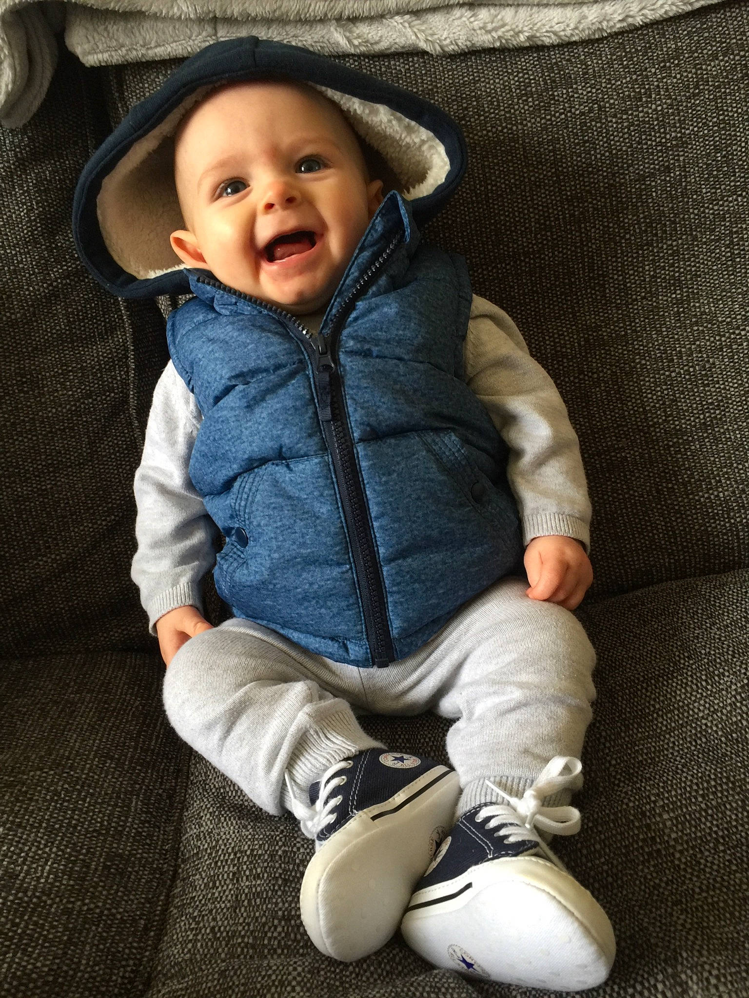 Harlie joined the competition — help win amazing prizes! baby, cheek, child, child_model, cool, footwear, fun, headgear, hood, hoodie, jacket, jeans, leg, outerwear, people, person, product, sitting, skin, smile