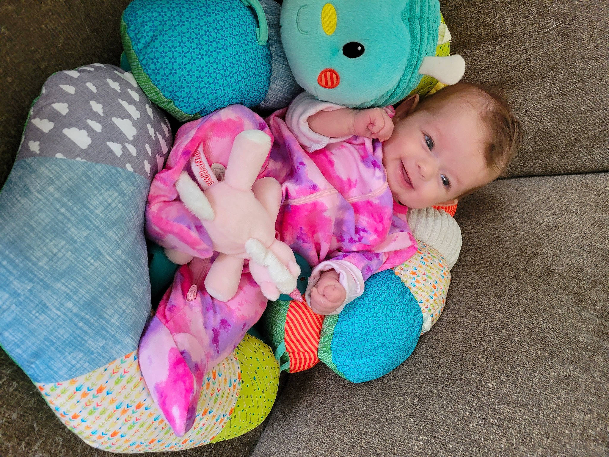 Maia is registered to the contest to win money with this photo: baby, baby_products, baby_sleeping, baby_toddler_clothing, blue, cheek, child, comfort, doll, person, pink, plush, purple, skin, sock, stuffed_toy, textile, toddler, toy, vertebrate