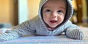 Margo is registered to the contest to win money with this photo: baby, babylaughing, bonnet, cap, clothing, crawling, face, happy, hat, head, hood, hoodie, knitwear, newborn, person, photography, portrait, smile, sweater, sweatshirt