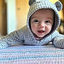 baby, babylaughing, bonnet, cap, clothing, crawling, face, happy, hat, head, hood, hoodie, knitwear, newborn, person, photography, portrait, smile, sweater, sweatshirt