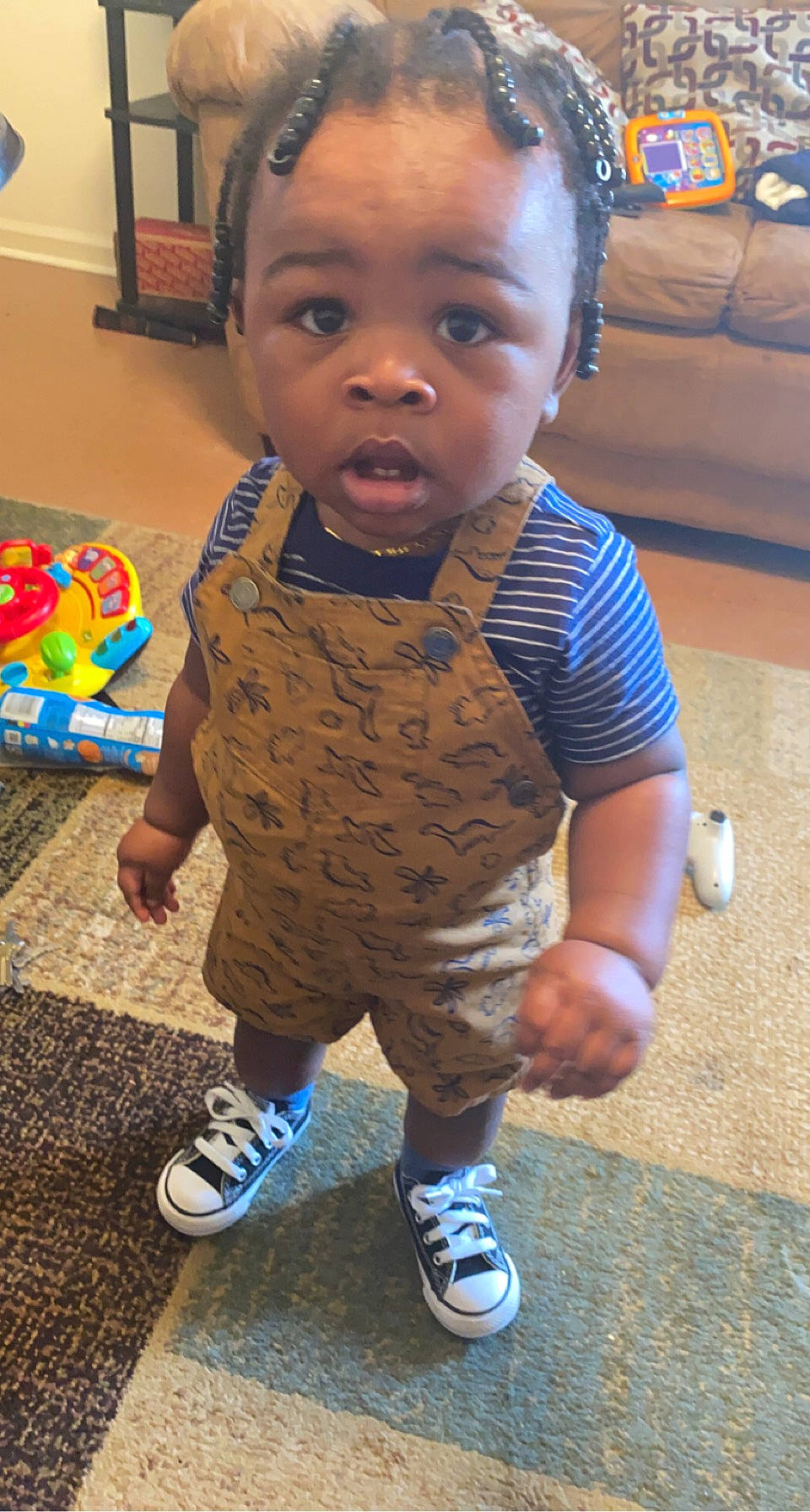 Kason is registered to the contest to win money with this photo: baby, baby_toddler_clothing, cheek, child, couch, floor, flooring, fun, hair, hairstyle, happy, head, nose, person, skin, sleeve, snapshot, t_shirt, textile, toddler