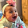 Elody is registered to the contest to win money with this photo: baby, child, smiling, headband, flower, indoor, clothing, minnie_mouse, cute, happy, portrait, person, infant, pink, toy, closeup, young, face, expression, sitting