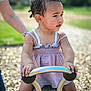 toddler, child, playground, outdoor, metal_handle, dress, person, hand, wood_chips, nature, support, adult, summer, cute, curly_hair, earring, daylight, park, fun, young