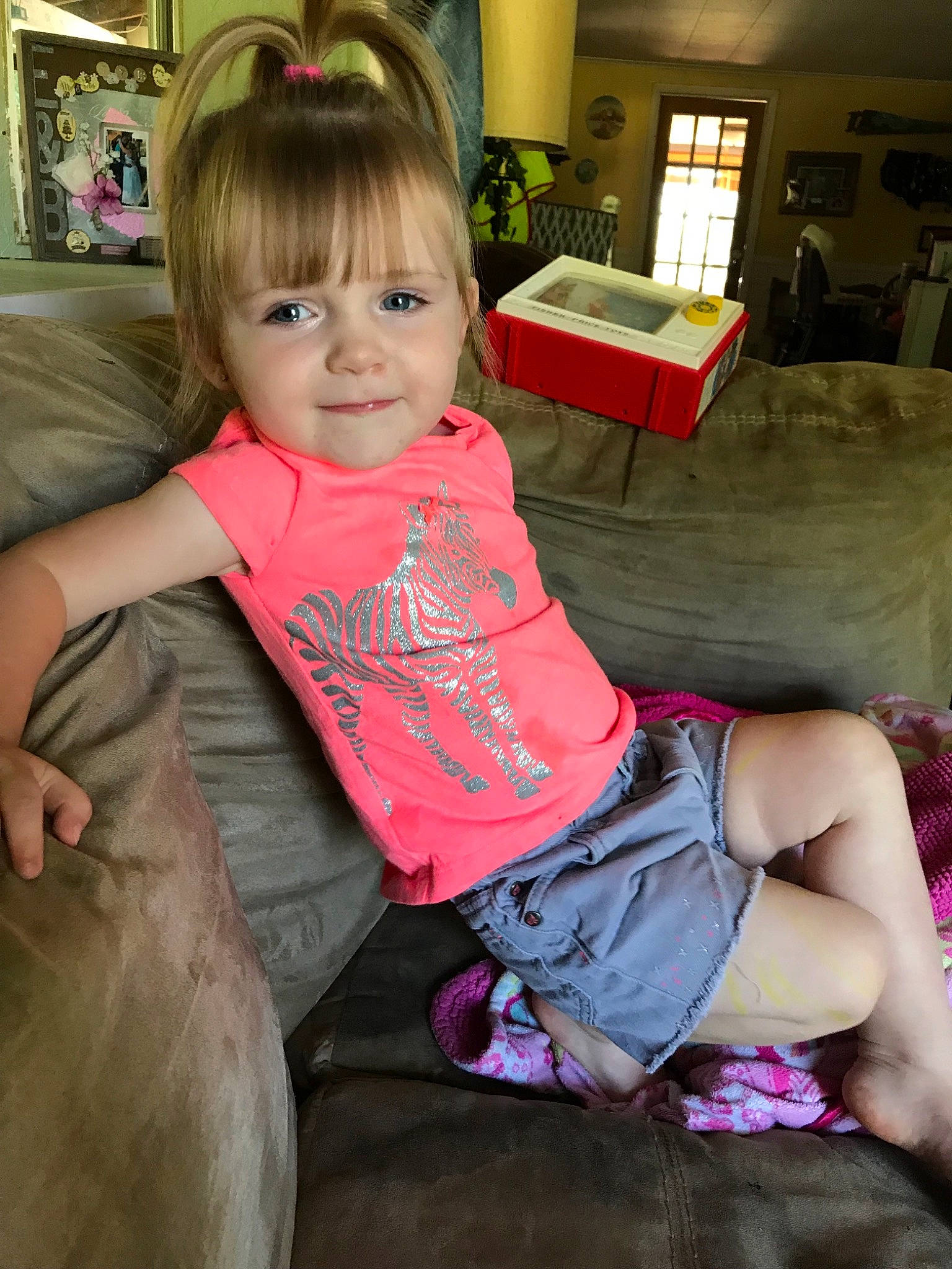 Rileyann is registered to the contest to win money with this photo: abdomen, arm, blond, child, day, fun, girl, human_hair_color, infant, leg, person, pink, play, product, sitting, skin, smile, textile, toddler, trunk