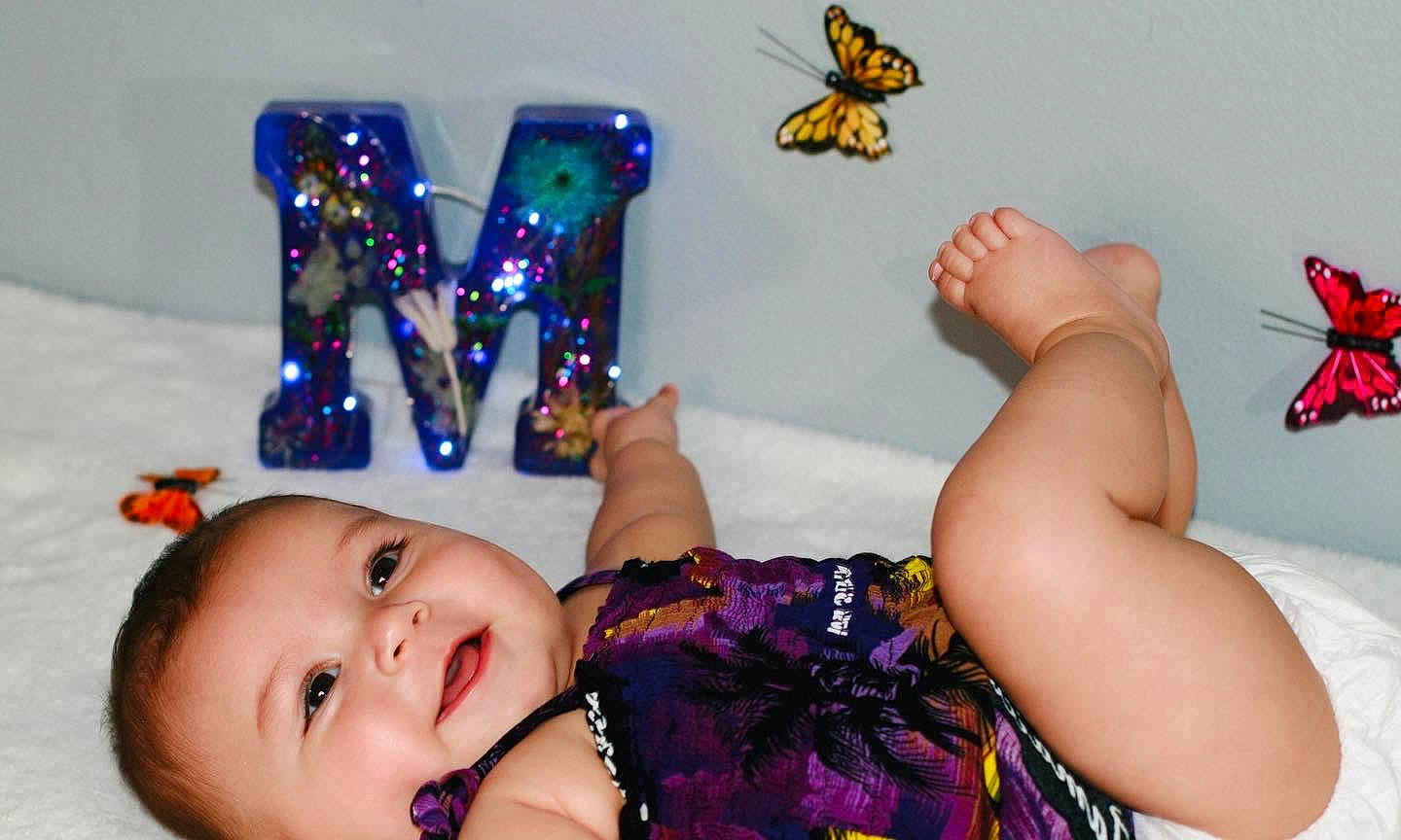 Melanie joined the competition — help win amazing prizes! arthropod, butterfly, child, comfort, eye, finger, gesture, hand, happy, leg, nail, person, pink, pollinator, product, purple, smile, textile, toddler, white