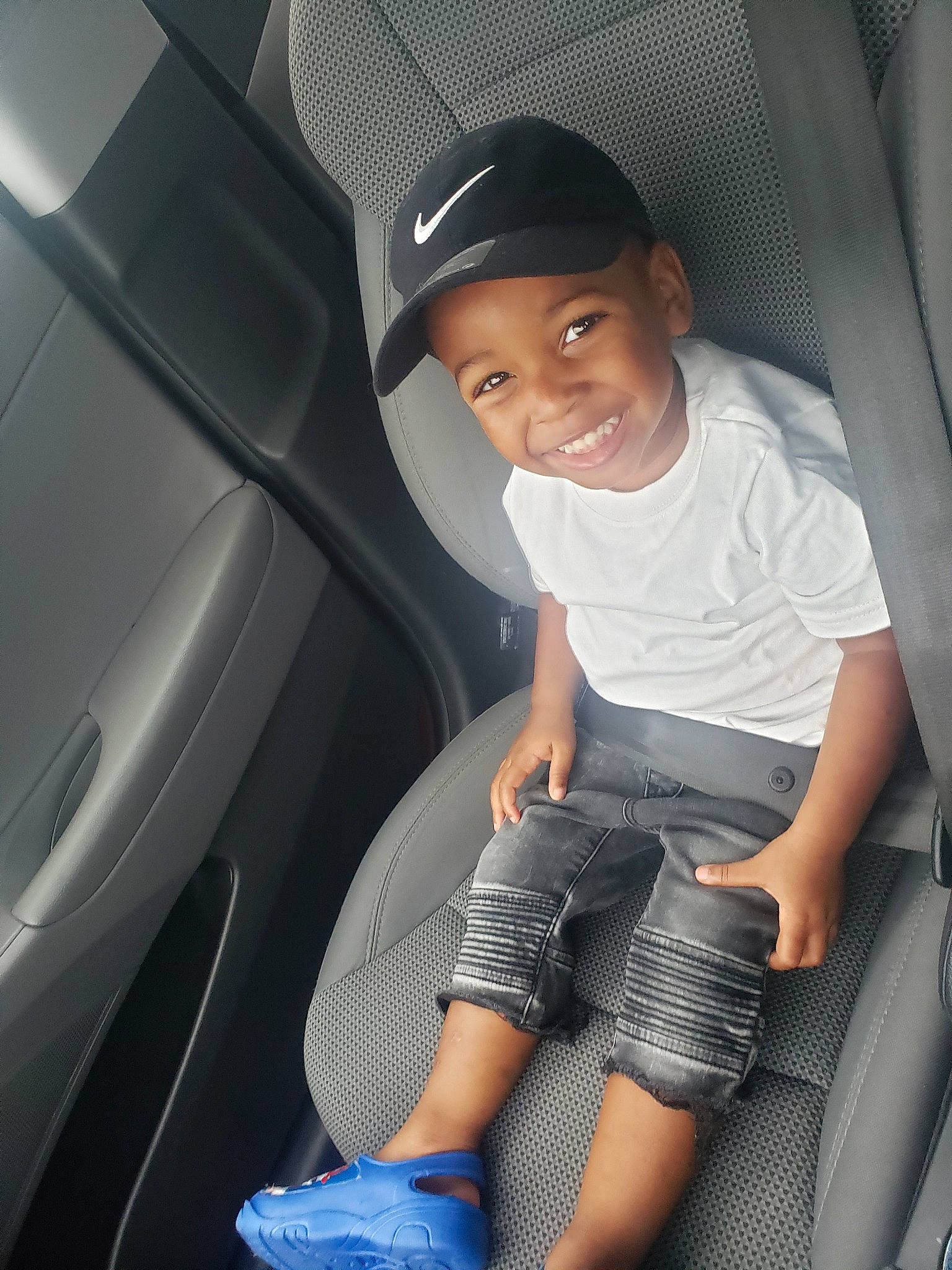 Eugene is registered to the contest to win money with this photo: auto_part, car, car_seat, child, family_car, headwear, joy, person, seat_belt, vehicle, vehicle_door