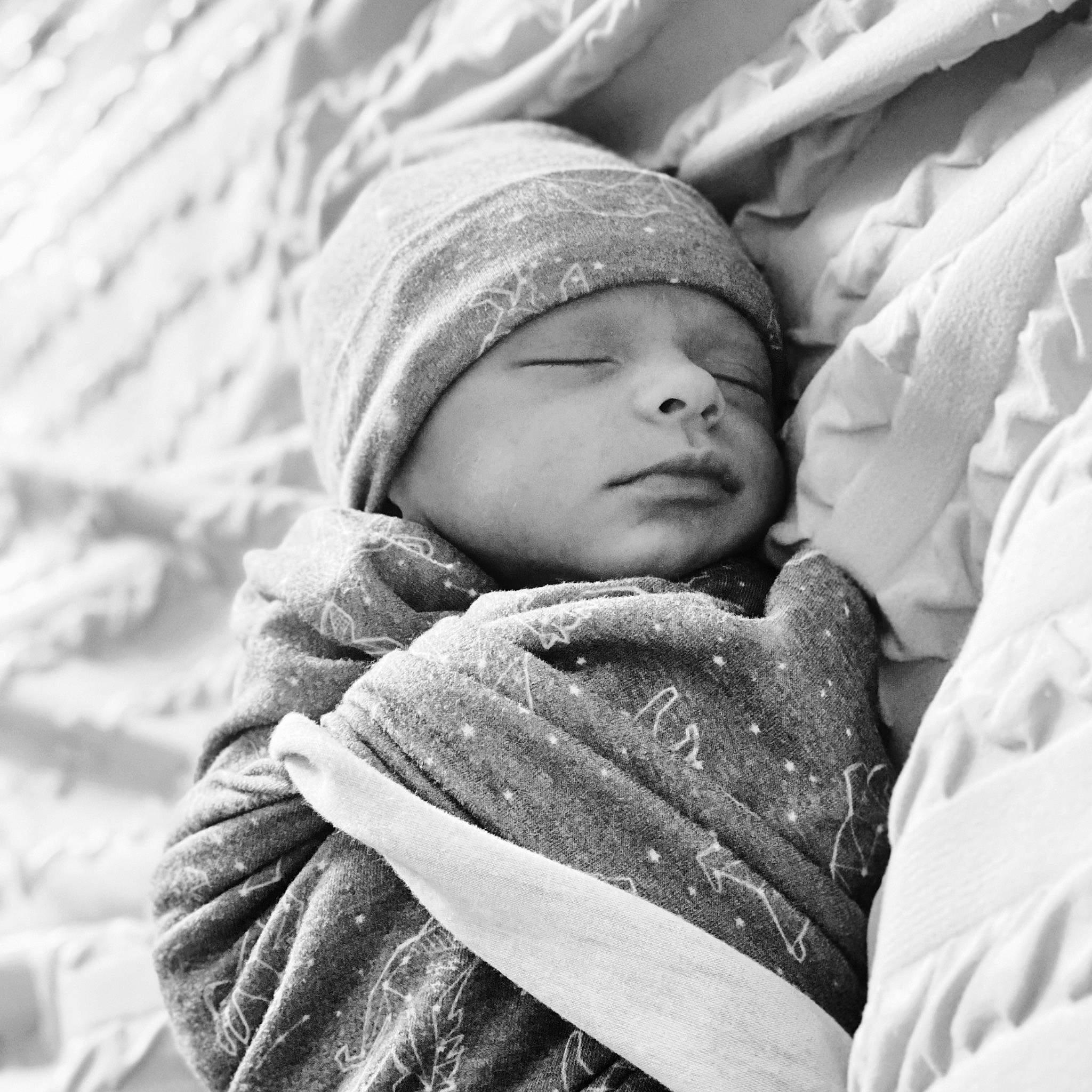 Kyden joined the competition — help win amazing prizes! baby, black_and_white, cheek, child, close_up, comfort, grey, happy, headgear, headwear, linens, monochrome, monochrome_photography, outerwear, people_in_nature, person, photograph, skin, textile, toddler
