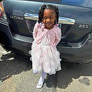 Amora joined the competition — help win amazing prizes! blackhair, braid, bumper, car, child, clothing, cornrows, curlyhair, face, female, girl, hair, head, person, sedan, sitting, sleeve, standing, transportation, vehicle