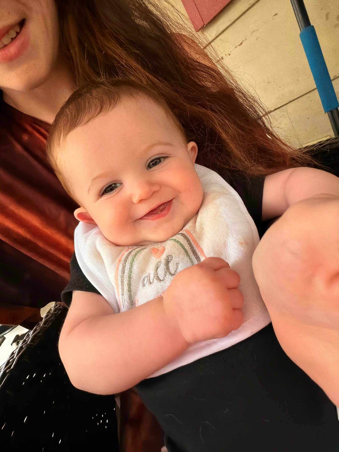 Nevaeh joined the competition — help win amazing prizes! baby, child, smiling, person, face, bib, arm, hand, hair, woman, indoor, clothing, black_clothing, happy, skin, closeup, holding, seat, background, casual