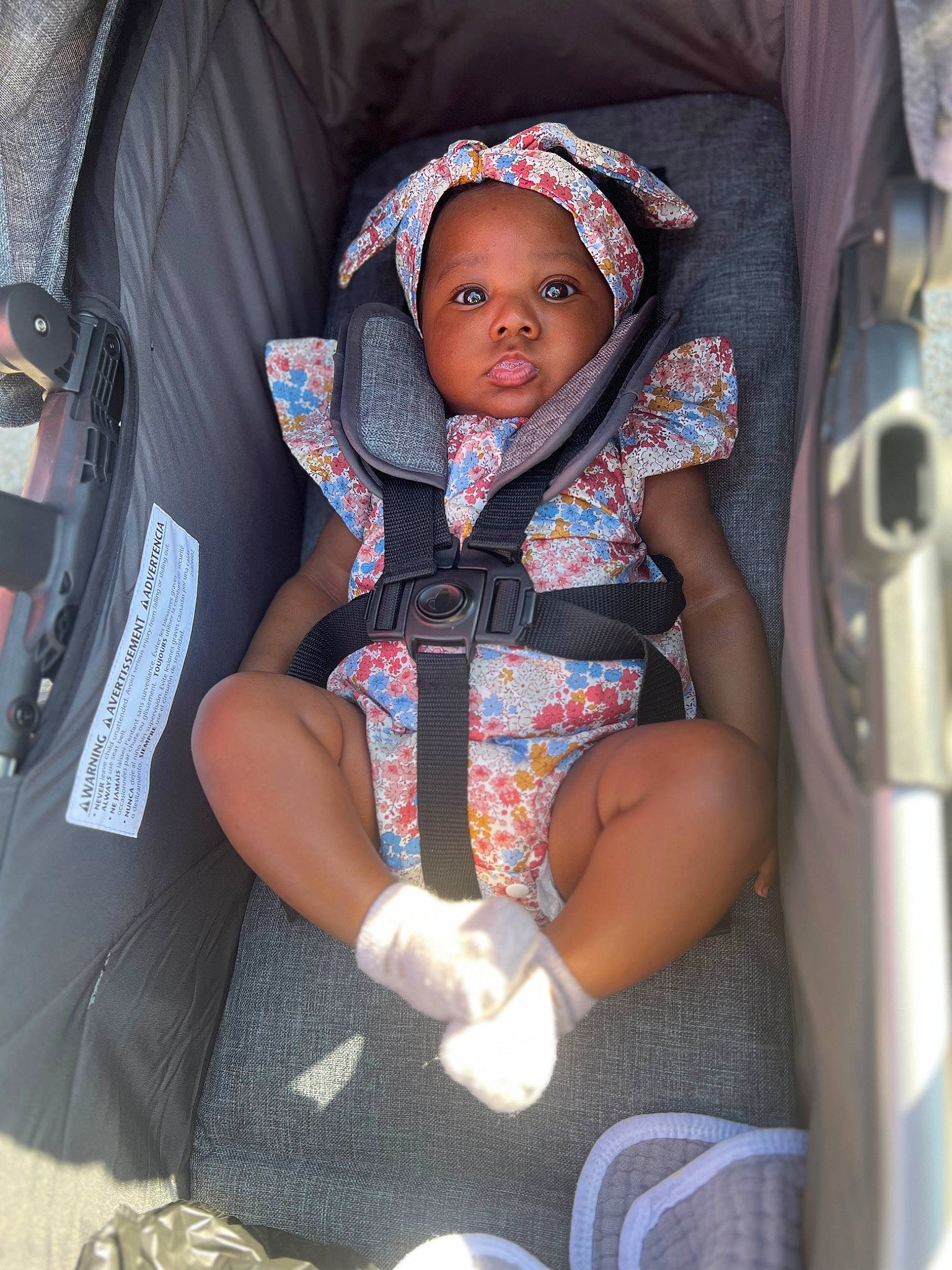 Kennedy joined the competition — help win amazing prizes! baby, baby_carriage, baby_products, baby_safety, baby_toddler_clothing, bag, car_seat, chair, child, comfort, electric_blue, fashion_accessory, fun, human_leg, lap, luggage_and_bags, pattern, person, sitting, thigh