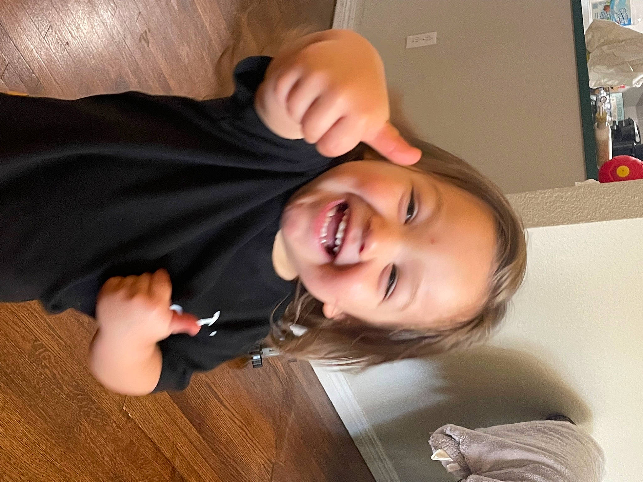 Eric is registered to the contest to win money with this photo: cheek, child, chin, ear, eyebrow, eyelash, finger, flooring, fun, gesture, happy, joy, lip, mouth, nose, person, skin, smile, thumb, varnish