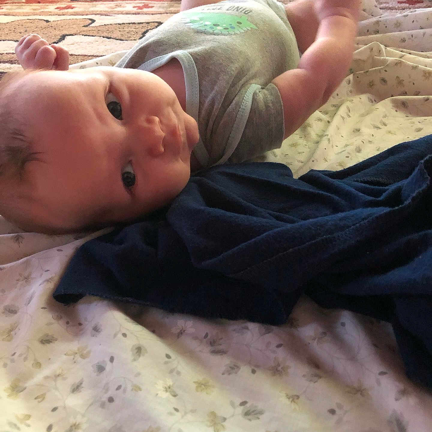 Ragnar is registered to the contest to win money with this photo: baby, baby_toddler_clothing, beach, bed, bedding, child, comfort, fun, human_leg, leisure, linens, pattern, room, sand, sitting, skin, sleeve, thumb, toddler, wood