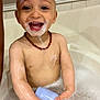 toddler, bath, soap, bubbles, foam, child, happy, smiling, water, bathtub, skin, necklace, toy, wet, arms, head, face, teeth, playful, indoor