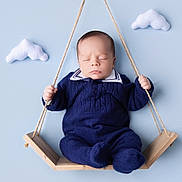 Andrew joined the competition — help win amazing prizes! baby, infant, sleeping, swing, wooden_swing, blue_background, knitwear, navy_blue, cute, peaceful, clouds, felt_clouds, soft_lighting, portrait, child, newborn, indoors, handheld, cozy, adorable