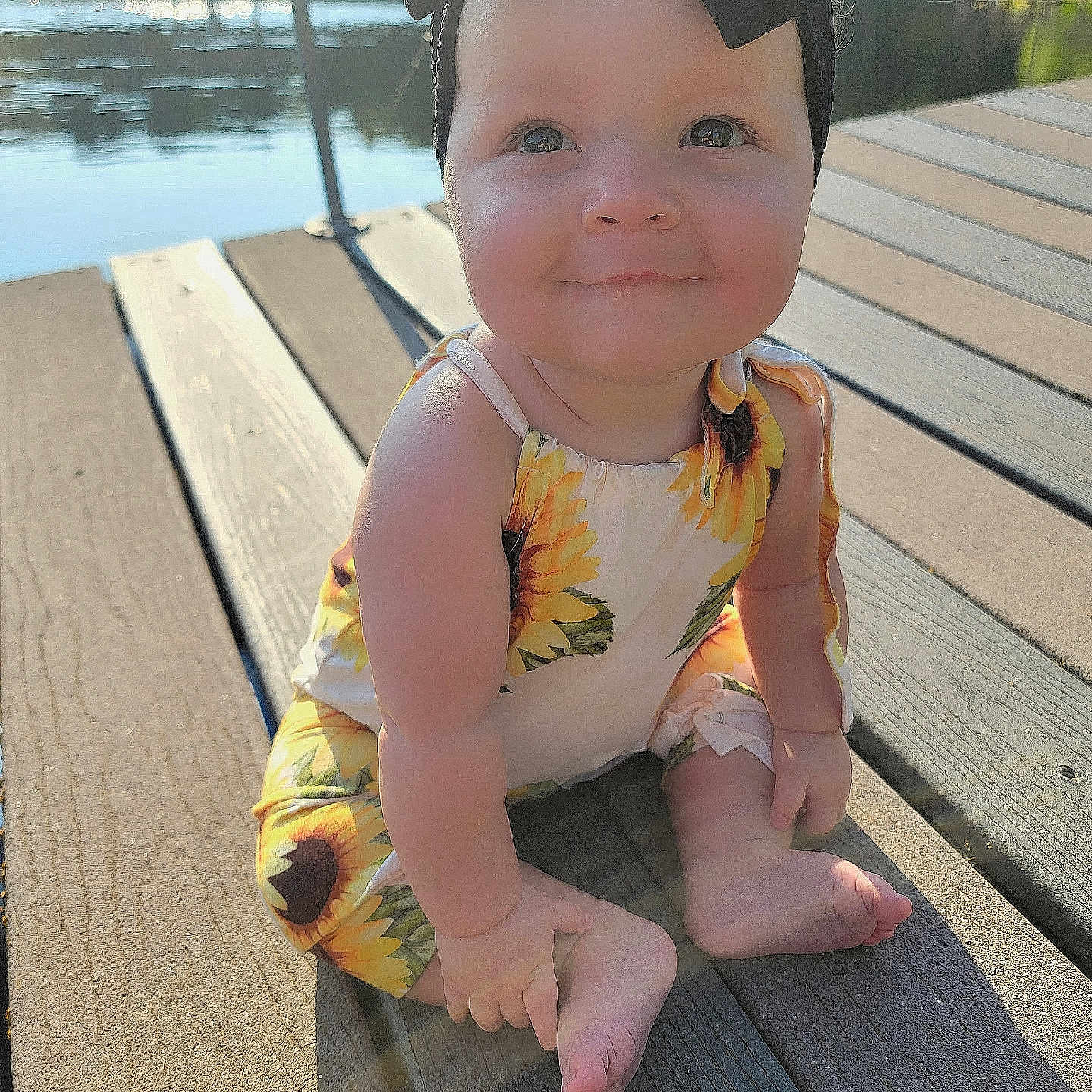 Rebel is registered to the contest to win money with this photo: architecture, baby, boardwalk, bridge, building, deck, face, head, house, housing, person, photography, pier, porch, port, portrait, sitting, water, waterfront, wood