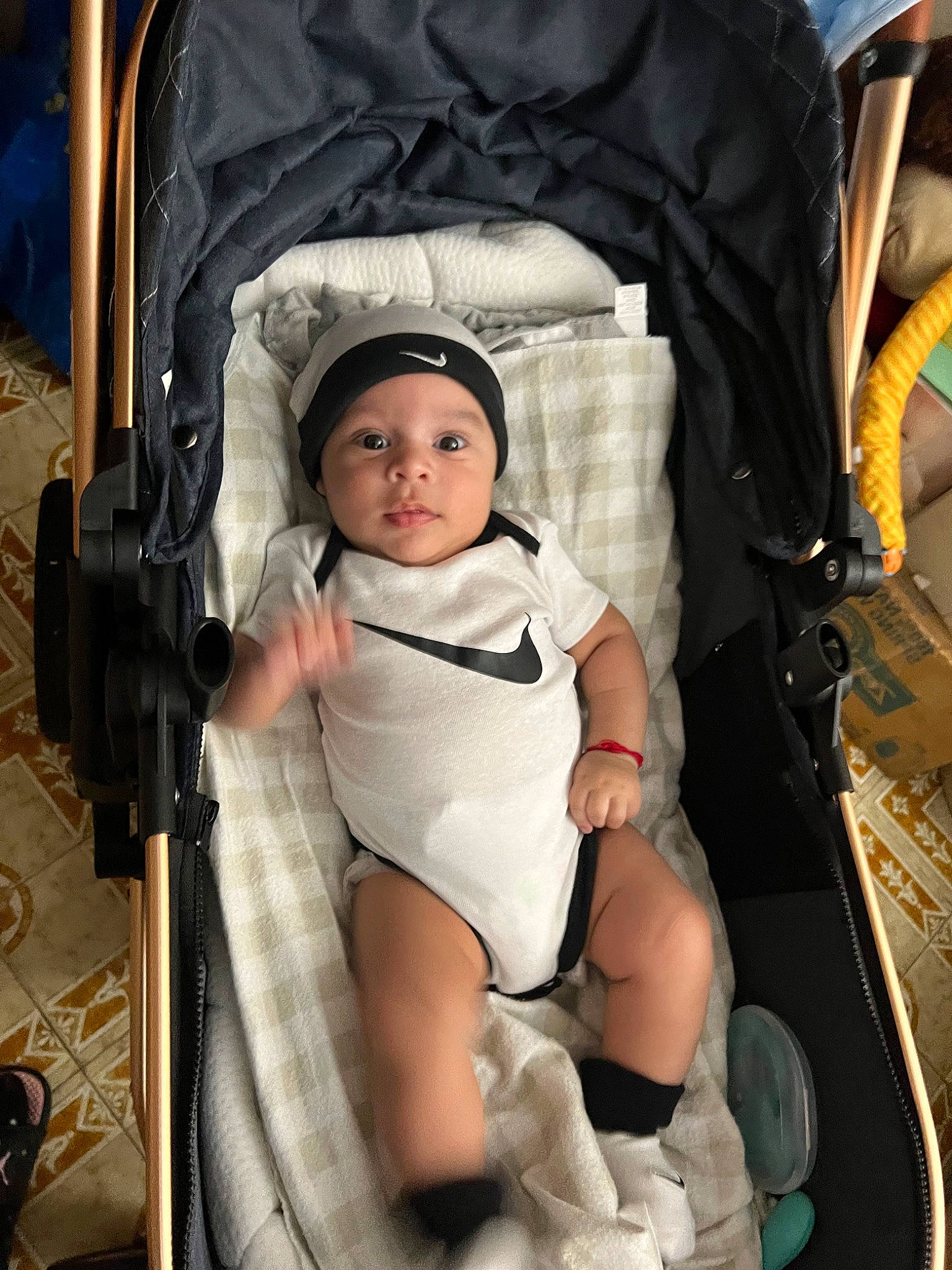 Craig is registered to the contest to win money with this photo: baby, baby_carriage, baby_products, baby_safety, baby_toddler_clothing, bag, car_seat, chair, cheek, child, comfort, eye, fun, headwear, human_body, infant_bed, person, photograph, product, sitting