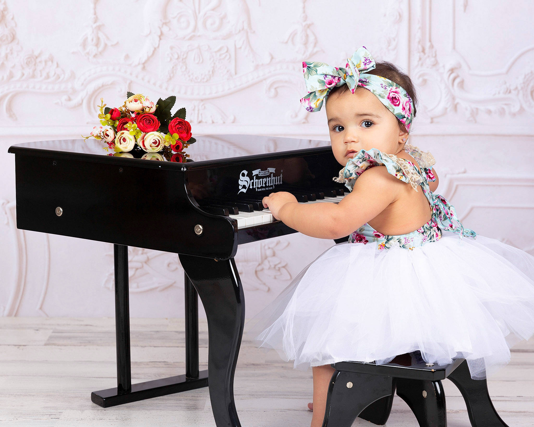 Mariangelik is registered to the contest to win money with this photo: child, child_model, clothing, costume, desk, dress, fashion_accessory, flower, flower_girl, formal_wear, furniture, headwear, person, petal, pianist, piano, product, recital, sitting, table