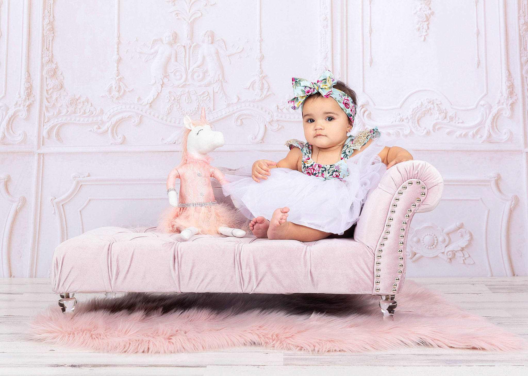 Mariangelik is registered to the contest to win money with this photo: baby, chair, child, couch, crown, ear, fur, furniture, hair_accessory, headgear, headpiece, person, photo_shoot, photograph, photography, pink, room, shoe, sitting, stock_photography