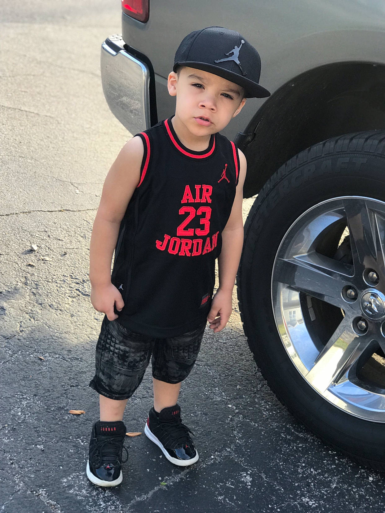 Orlando is registered to the contest to win money with this photo: auto_part, automotive_tire, automotive_wheel_system, car, child, child_model, clothing, cool, footwear, headwear, male, muscle, outerwear, person, photography, shoe, sportswear, t_shirt, tire, vehicle