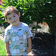 Tulson joined the competition — help win amazing prizes! child, boy, smiling, garden, plants, greenery, sunlight, outdoor, grass, flower_bed, tree, shirt, patterned_clothing, happy, young, nature, daylight, casual, portrait, playful