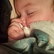 Greyson is registered to the contest to win money with this photo: baby, blanket, child, closeup, comfort, cozy, cuddle, face, hand, indoors, infant, pacifier, peaceful, portrait, relax, rest, sleeping, soft, warm, young