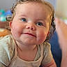 baby, blue_eyes, cheeks, child, closeup, clothing, curly_hair, cute, expression, face, happy, indoors, infant, person, portrait, skin, sleeves, smile, soft_light, young