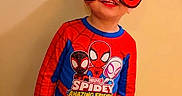 Kabir is registered to the contest to win money with this photo: blue, boy, casual, child, clothing, costume, fun, happy, indoor, kid, mask, playful, portrait, posing, red, smiling, spiderman, standing, superhero, wall
