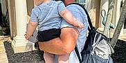 William joined the competition — help win amazing prizes! baby, backpack, barefoot, building, cap, carrying, casual_clothing, child, columns, dad, family, father, hat, outdoor, palm_tree, person, shorts, sunny, together, tshirt