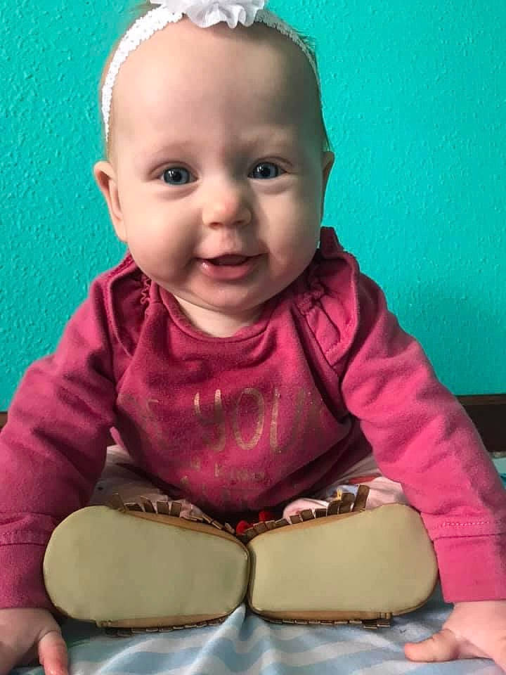 Madeline is registered to the contest to win money with this photo: baby_toddler_clothing, cheek, chin, cool, dress, face, facial_expression, finger, hairstyle, happy, human, iris, lip, neck, nose, person, pink, skin, sleeve, smile