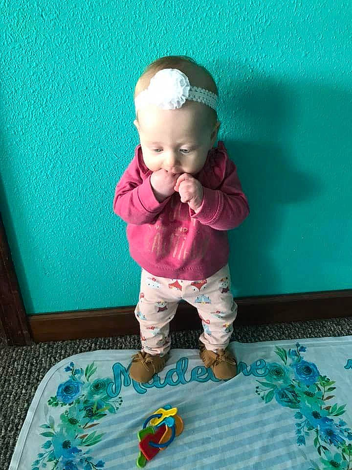 Madeline is registered to the contest to win money with this photo: aqua, baby, baby_products, baby_toddler_clothing, blue, child, flooring, fun, grass, green, happy, leisure, magenta, mammal, person, pink, sleeve, smile, textile, toddler