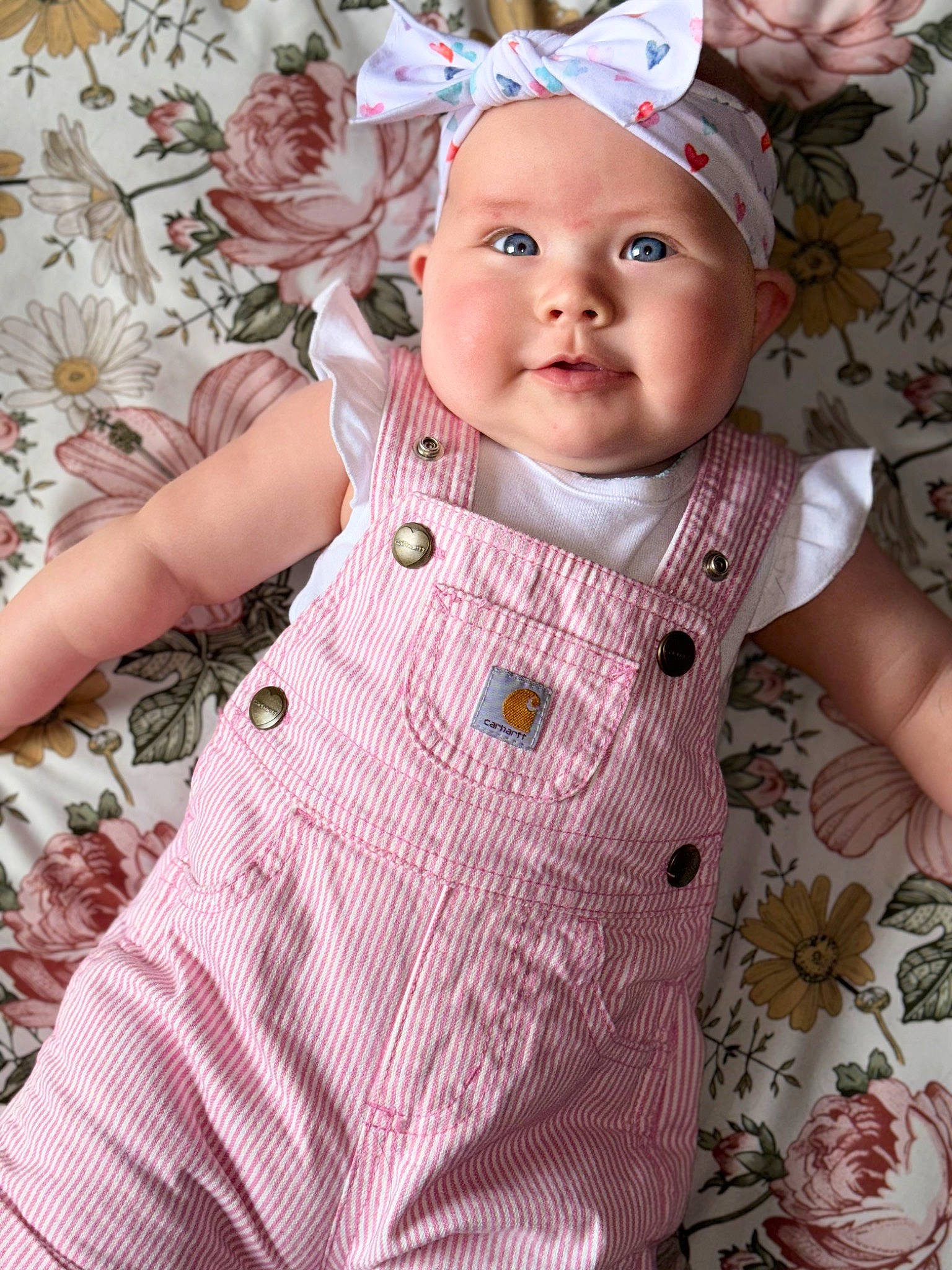 Adaline joined the competition — help win amazing prizes! baby, baby_products, baby_toddler_clothing, button, cheek, child, dress, dress_shirt, face, grass, headwear, iris, linens, lip, pattern, person, pink, skin, sleeve, textile