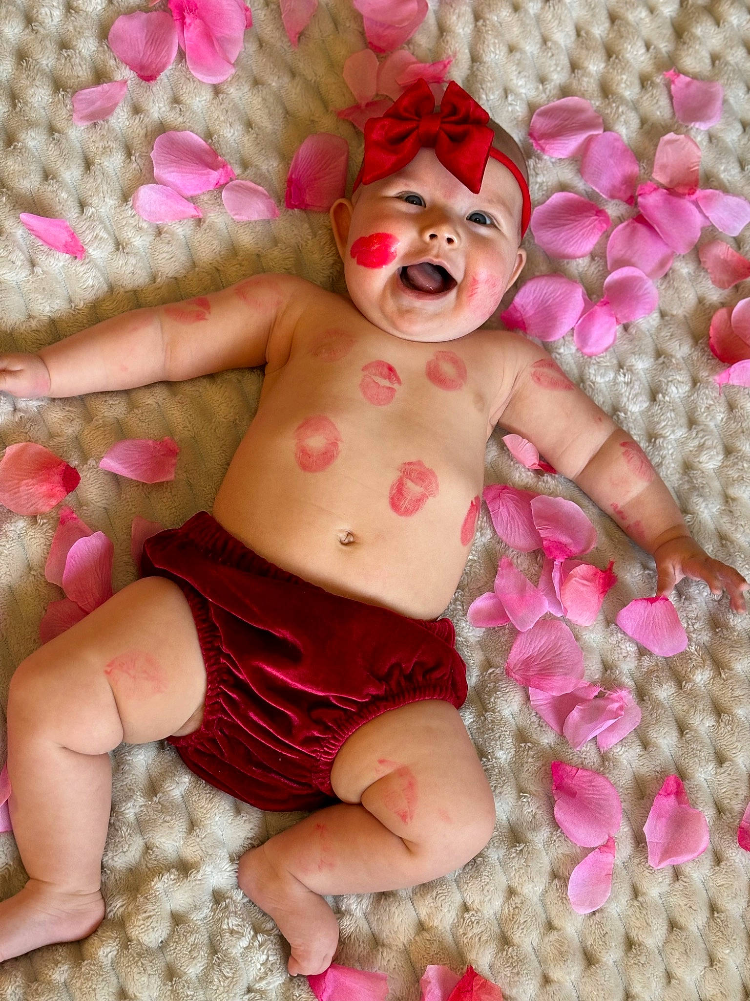 Adaline is registered to the contest to win money with this photo: arm, baby, baby_sleeping, baby_toddler_clothing, chest, child, comfort, event, finger, happy, headwear, linens, magenta, nail, pattern, person, petal, pink, textile, thigh