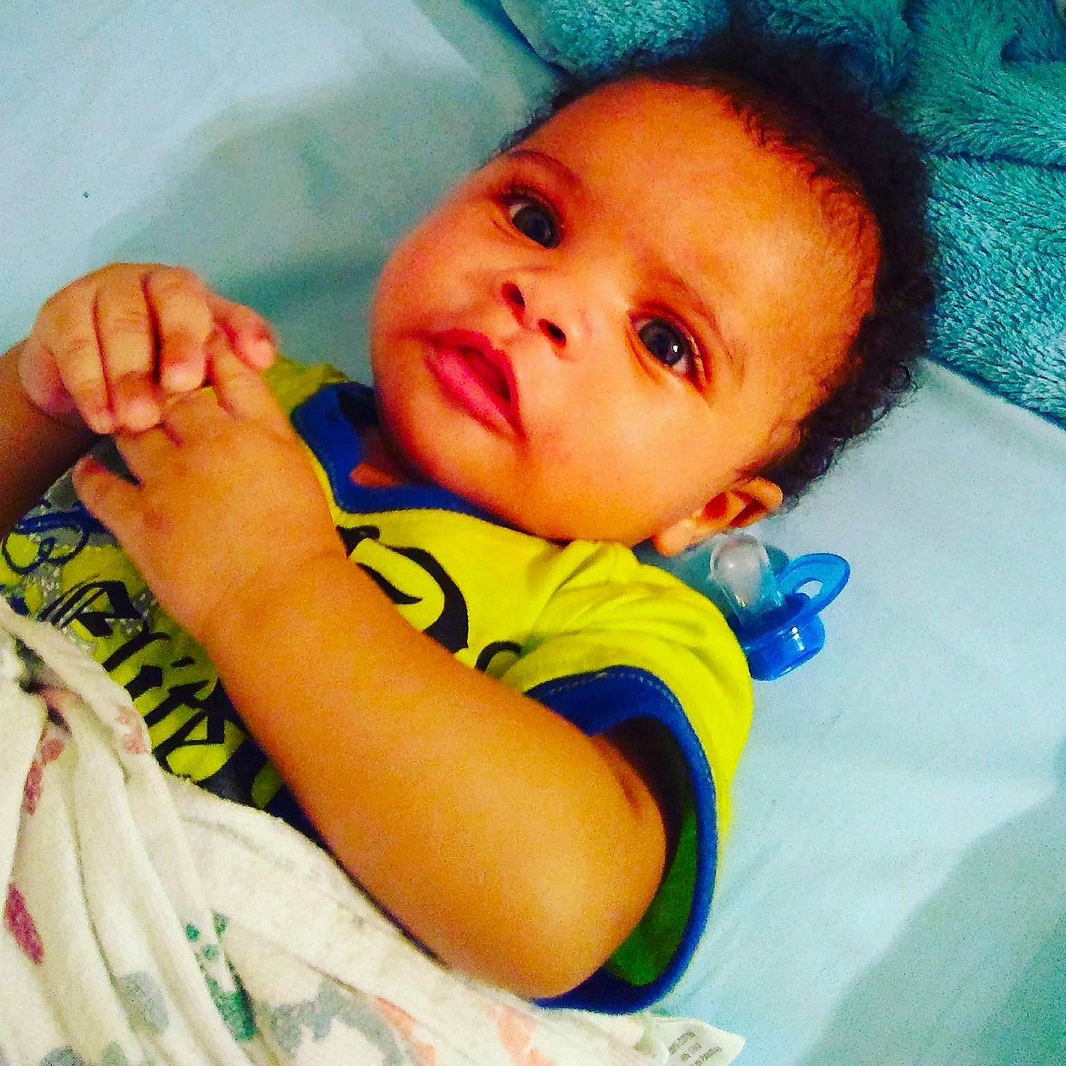 Raheem is registered to the contest to win money with this photo: arm, cheek, child, ear, eye, face, finger, girl, hand, head, infant, leg, lip, mouth, nose, person, play, product, skin, toddler