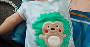 Django participe au concours pour gagner de l'argent avec cette photo : accessories, applique, baby, bib, blanket, bodypart, clothing, face, finger, hand, head, jewelry, newborn, pattern, person, photography, portrait, shirt, t_shirt, undershirt